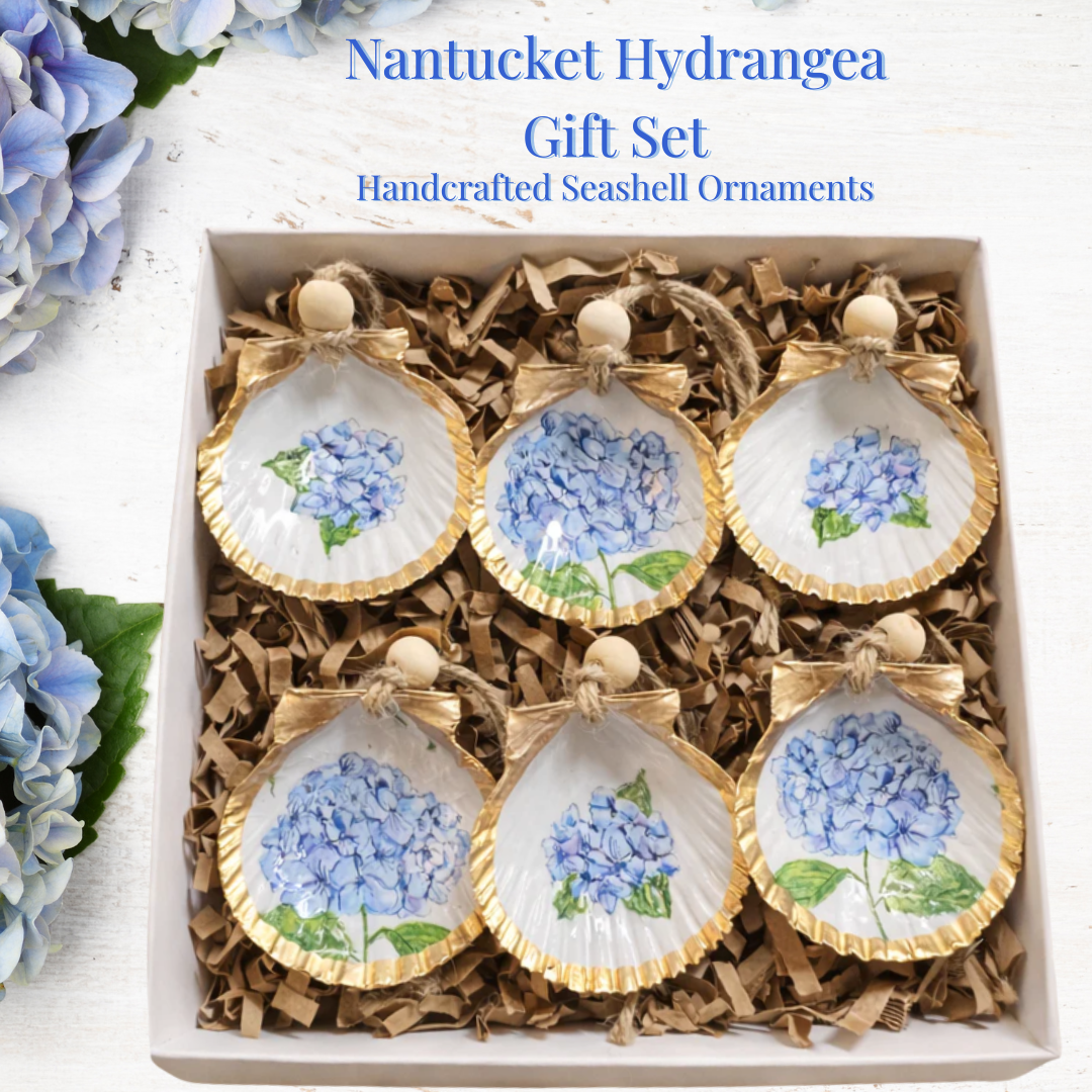 Nantucket Hydrangea gift set with handcrafted seashell ornaments in a box, surrounded by blue hydrangeas.
