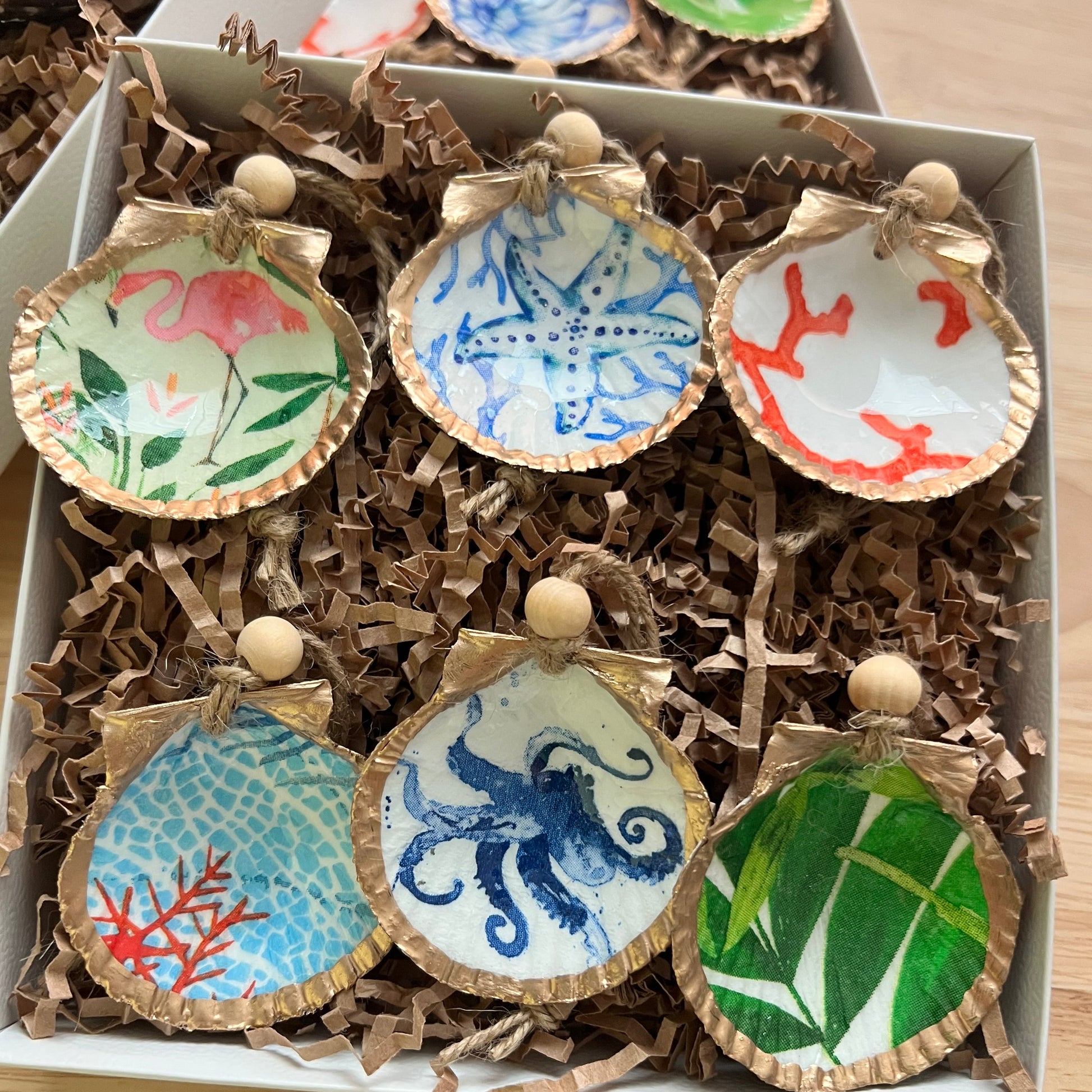 Decorative cookies with artistic designs in a box on a wooden surface