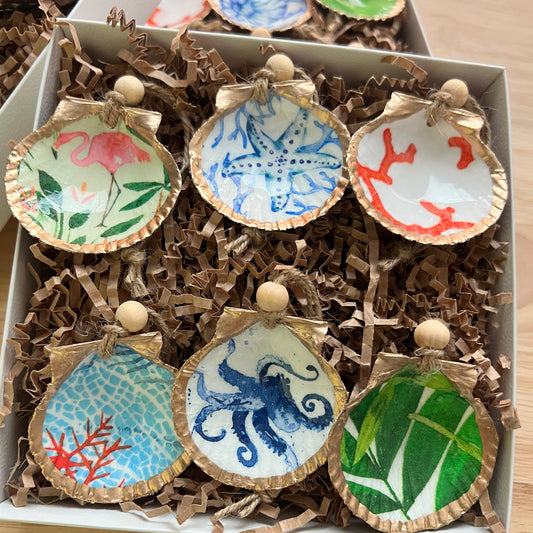 Decorative cookies with artistic designs in a box on a wooden surface