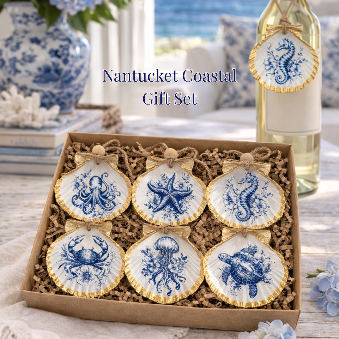 Nantucket Coastal gift set with cookies and a bottle of wine on a table with ocean view.