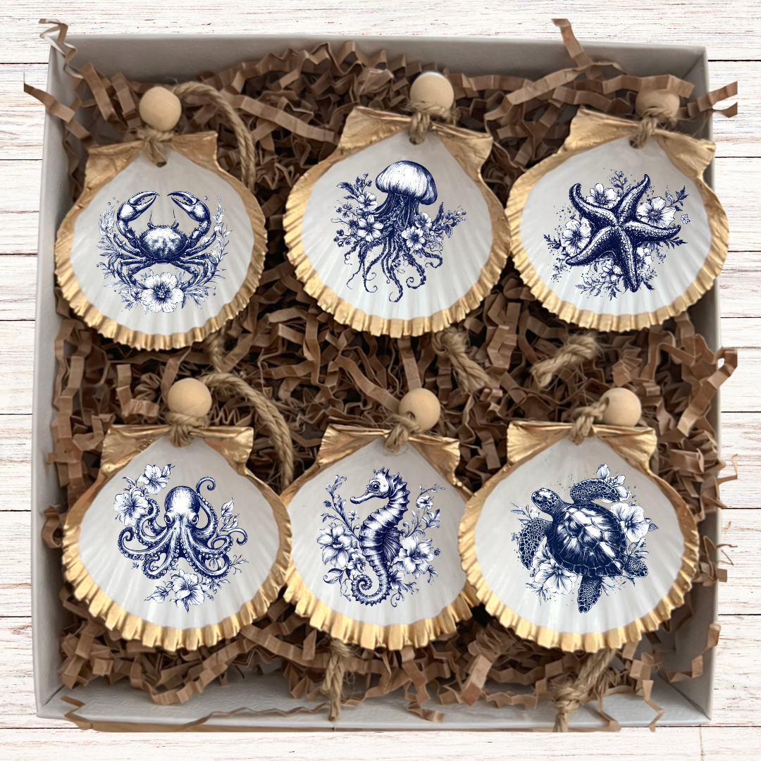 Nantucket Coastal gift set of handcrafted seashell ornaments with blue sea creature designs.